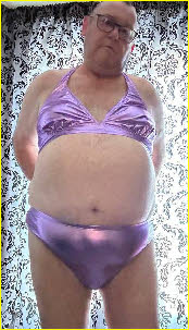 Ruined husband degrades himself by wearing shiny purple bikini