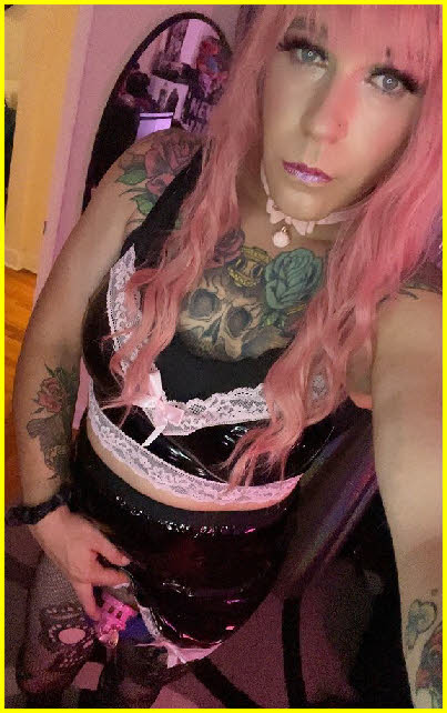 Sissy maid Nikki Graziano wearing tiny pink cock cage