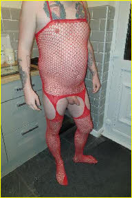 Sissy Charlotte in red fishnet body stocking