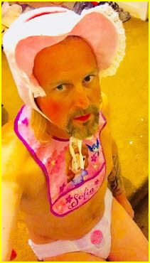 Adult baby Erica in bib and bonnet