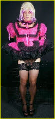 Sissy's pink maid uniform is too small to cover his limp caged dick