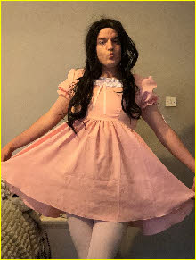 Masculine failure Emily practises his curtsey in a gay prink sissy frock Masculine failure Emily practises his curtsey in a gay prink sissy frock