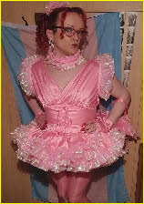 Mincing sissy Stephie Lou in a truly tragic frilly pink frock