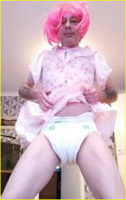 Ridiculous adult baby in pink wig and nappy