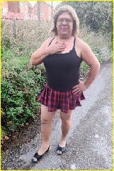 Transvestite trucker Becki outside in tight top and short skirt