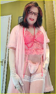 Mincing sissy Elizabeth looks like a proper little fairy in his pink basque and thong Mincing sissy Elizabeth looks like a proper little fairy in his pink basque and thong