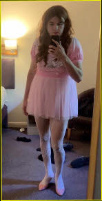 Mincing sissy Emily dressed in a laughably effeminate outfit Mincing sissy Emily dressed in a laughably effeminate outfit