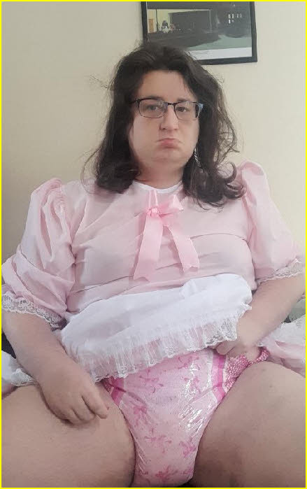 Sissy loser Emily in pink frock and padded nappy Sissy loser Emily in pink frock and padded nappy