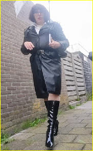 Dutch crossdresser Yvonne in long leather raincoat