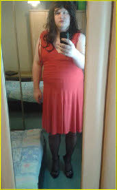 Sissy Casey in long red dress