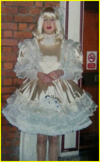 Cornwall sissy Trudy Beth Sparkles fully emasculated in frilly frock with petticoats galore