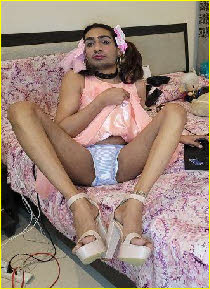 Cross-dressing sissy Maddy with pink ribbons in his hair Cross-dressing sissy Maddy with pink ribbons in his hair