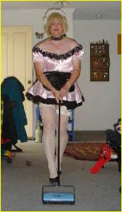 Broken husband forced to do the cleaning in pink maid frock
