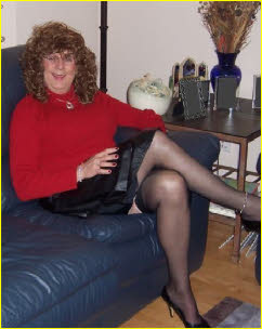Sissy BillieJo's skirt rides up to reveal a hint of stocking top