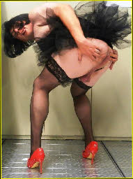 Sissy transvestite bends over and spreads his arse cheeks