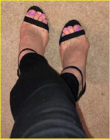 Sissy's painted pink toenails