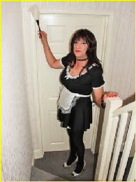 Cross-dressing maid Jeri Lee dusting in uniform