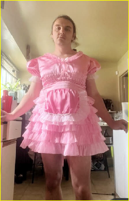 Tragic loser male exposed in frilly pink sissy frock