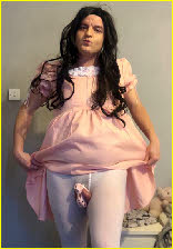 Sissy Emily hitches up his tragic pink frock to expose his caged clitoris