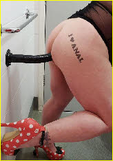 Sissy Debbie backs onto big black dildo