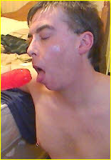 Exposed gay faggot Peter Fitton about to swallow a huge red dildo
