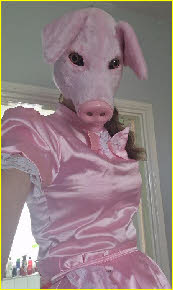 Pathetic sissy pig Cassandra in pink maid uniform and piggy mask