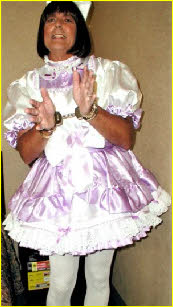 Sissy Michelle from Arizonal handcuffed in frilly satin maid uniform