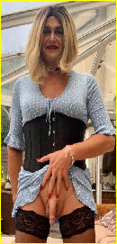 Married sissy Chrissy hitches up dress to expose limp manhood