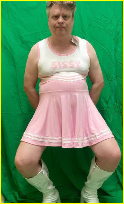 Degraded sissy Paul forced to pose in a pink cheerleader uniform Degraded sissy Paul forced to pose in a pink cheerleader uniform