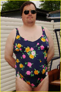 Loser male Holger exposed in a girlie swimming costume Loser male Holger exposed in a girlie swimming costume