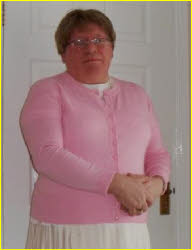 Sissy Bob looking prim in pink cardigan