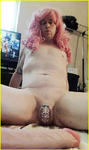 Locked sissy Kitiara exposes his silver clitoral cage