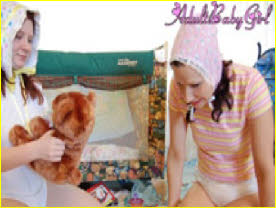 Grown women put on bibs and bonnets then play with toys in ABDL playroom